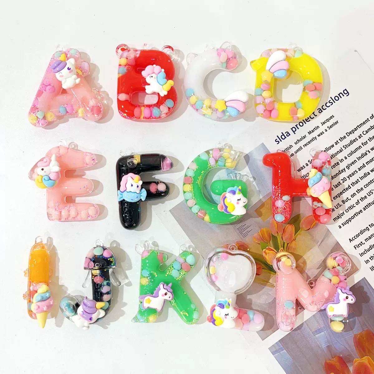 Wholesale of 26-letter keychains, bags, pendants, mini sand bottles, couple car key chains, pendants and gifts