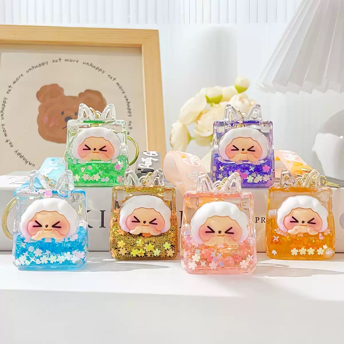 爆闪kk入油摆件 抖音同款液体流沙瓶桌面摆件多款式diy钥匙扣配饰 产品图