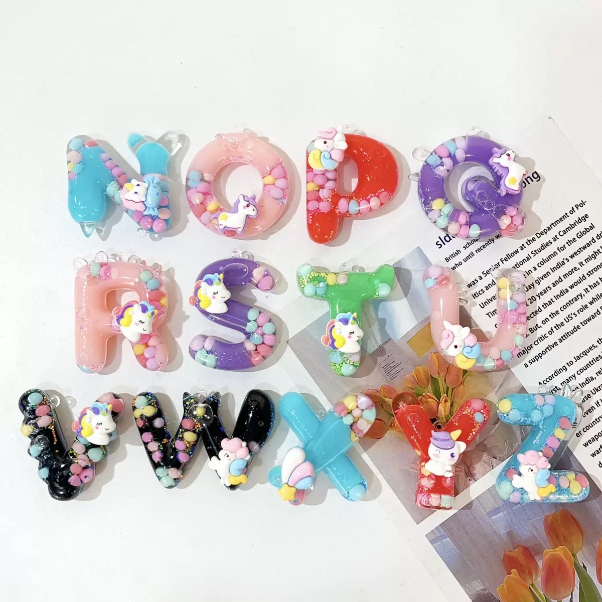 Wholesale of 26-letter keychains, bags, pendants, mini sand bottles, couple car key chains, pendants and gifts details Picture