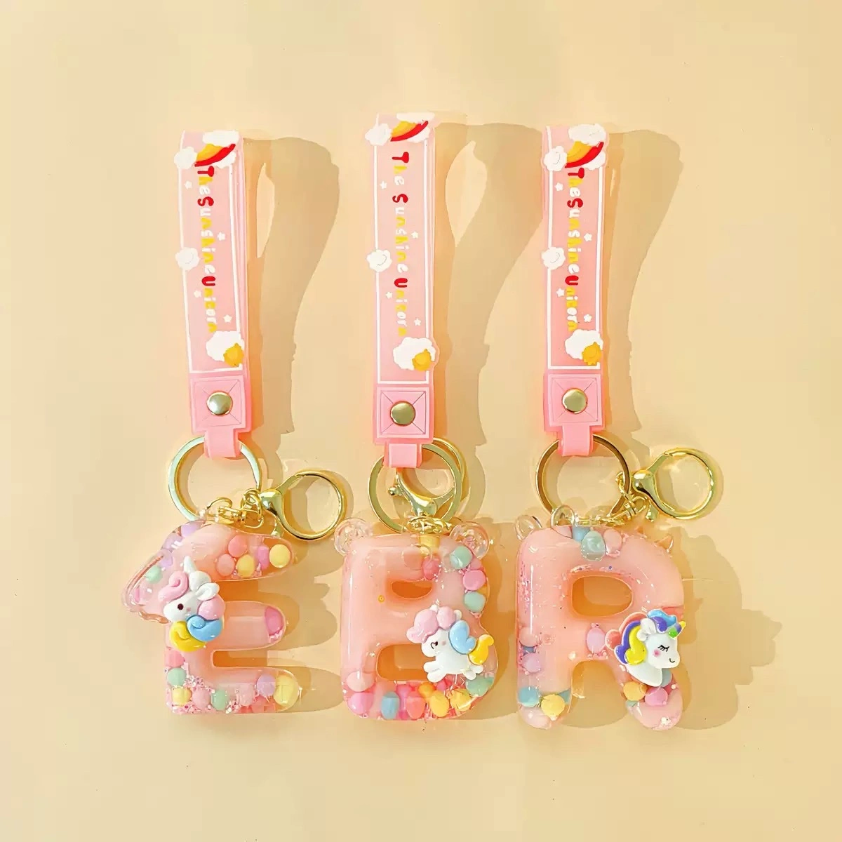 Wholesale of 26-letter keychains, bags, pendants, mini sand bottles, couple car key chains, pendants and gifts detail image 4