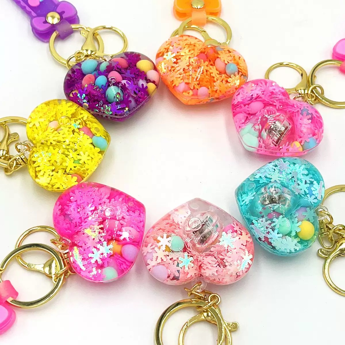 Creative acrylic illuminated heart keychains, liquid oil flowing sand key chains, car pendants and decorations wholesale blind boxes detail image 3