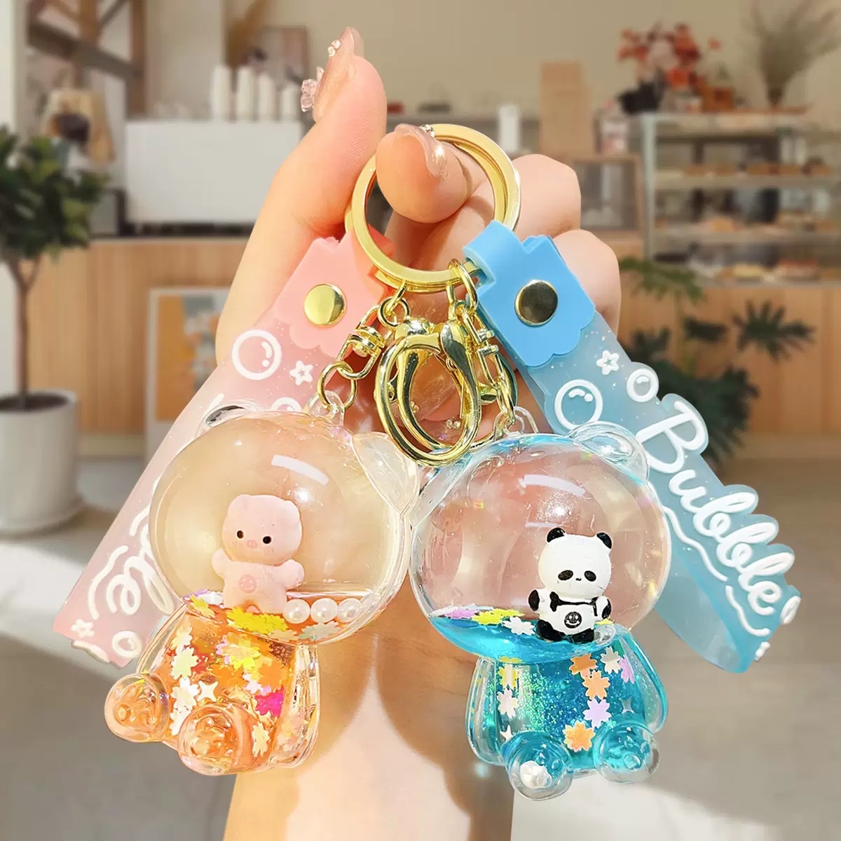 Creative oil sugar bean violent bear keychain pendant, acrylic flowing sand bottle bag pendant, small claw machine gift wholesale