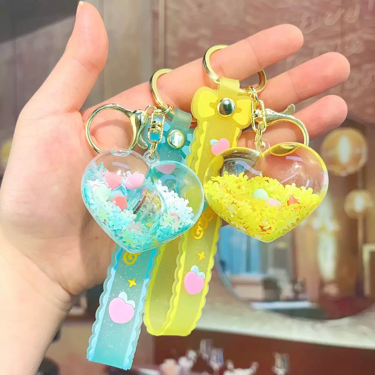 Creative acrylic illuminated heart keychains, liquid oil flowing sand key chains, car pendants and decorations wholesale blind boxes