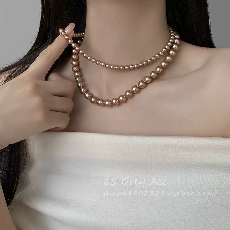 Youdaoplaceholder0 Brown-toned pearl layered necklace, with a multi-layer design to create a sense of layering, and a golden chain to add refinement. It can be worn in layers or alone in daily life. Gentle and eye-catching, it is a treasure accessory to enhance your temperament ~