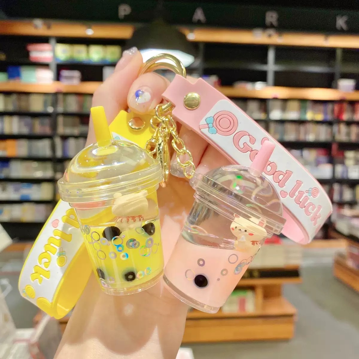 Internet-famous cartoon oil floating bubble milk tea bear keychain, cute and trendy car key chain, schoolbag pendant, blind box Item Picture