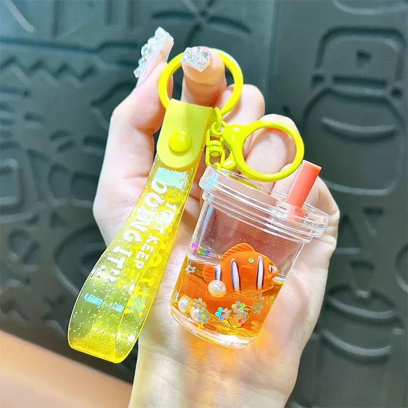 Cartoon oil-filled sand bottles, acrylic Ocean Story car keychains, pendants, chain decorations, wholesale small gifts, blind boxes Item Picture