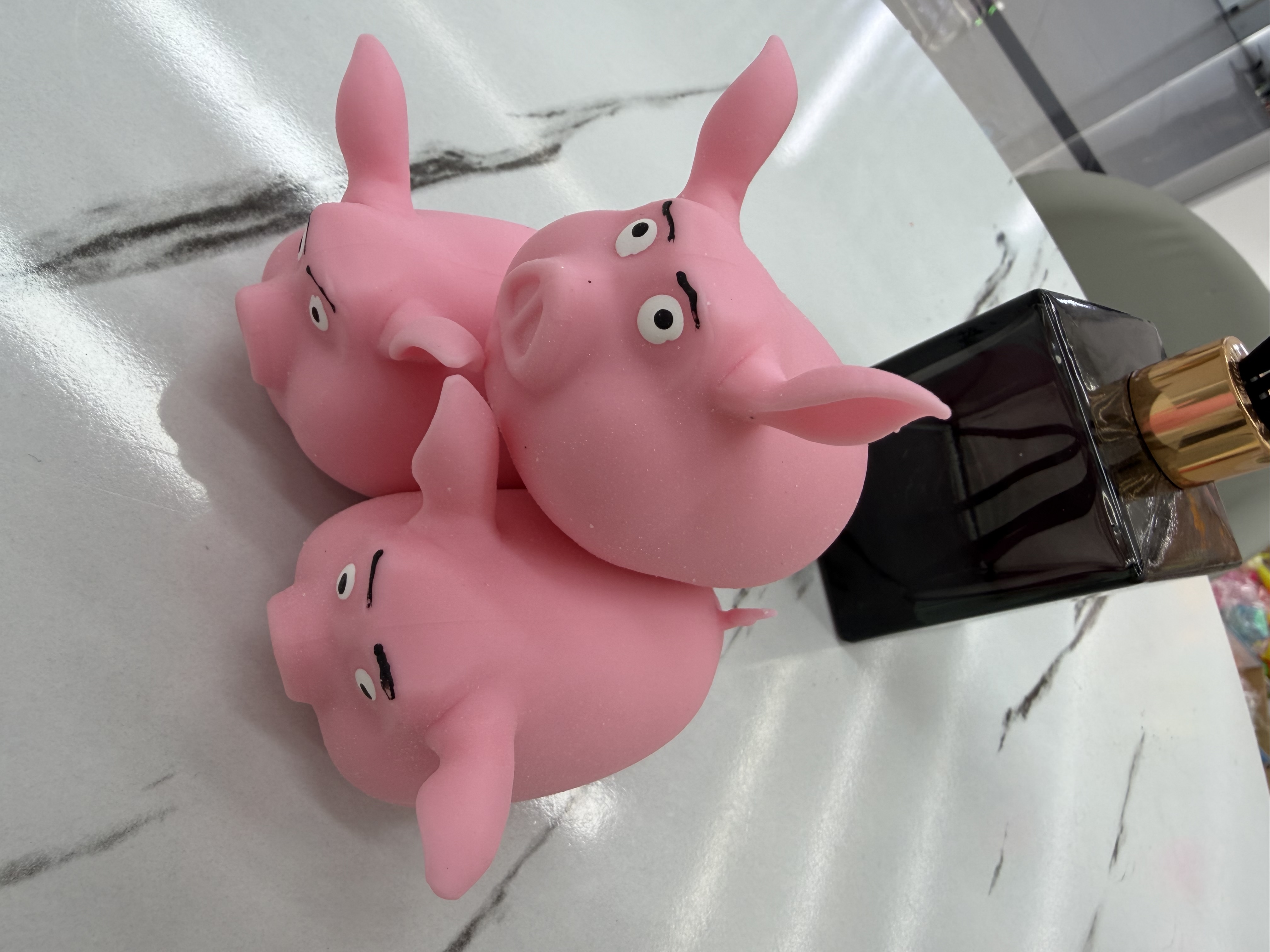 The little pig pinches the toy