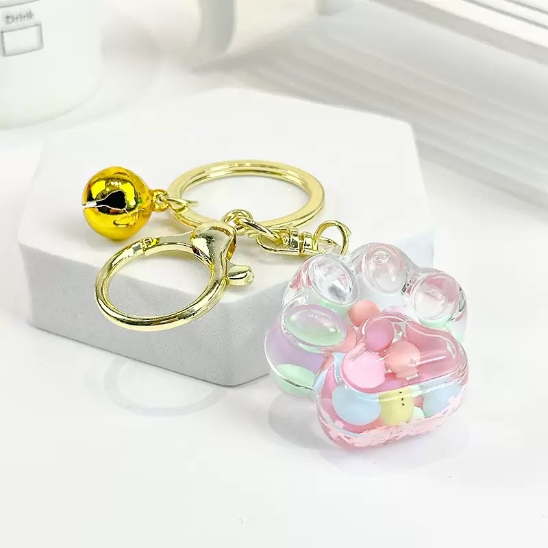 Wholesale of new oil-filled flowing sand keychains, cat paw drift bottles, flowing sand pendants, car cartoon key chains and small gifts detail image 5