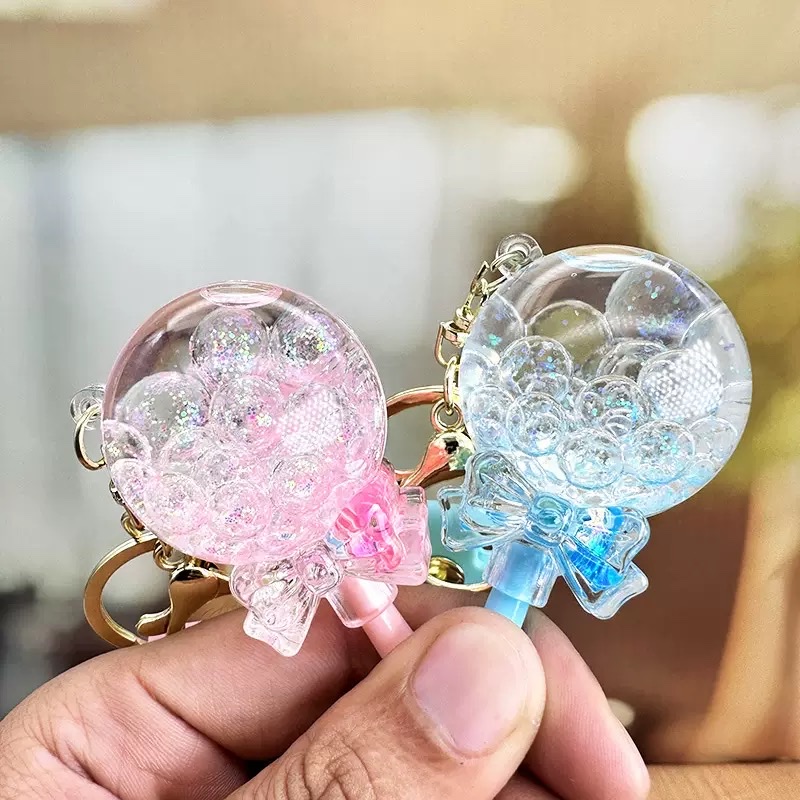 Flowing sand in oil, floating lollipop keychain, exquisite girls' small pendant, children's schoolbag, cute key chain hanging decoration, blind box detail image 4