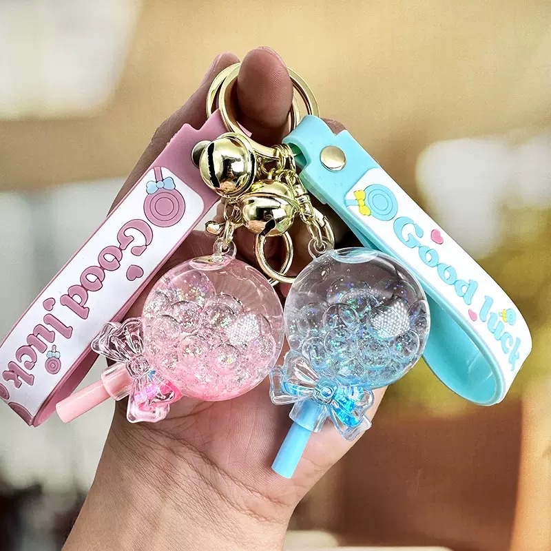 Flowing sand in oil, floating lollipop keychain, exquisite girls' small pendant, children's schoolbag, cute key chain hanging decoration, blind box