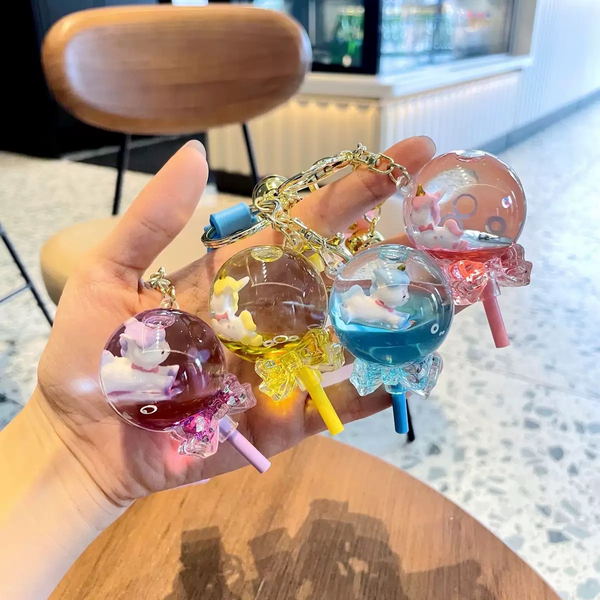 Lollipop float unicorn flow bottle keychain pendant, children's schoolbag pendant, oil-filled flowing sand, car keychain blind box details Picture