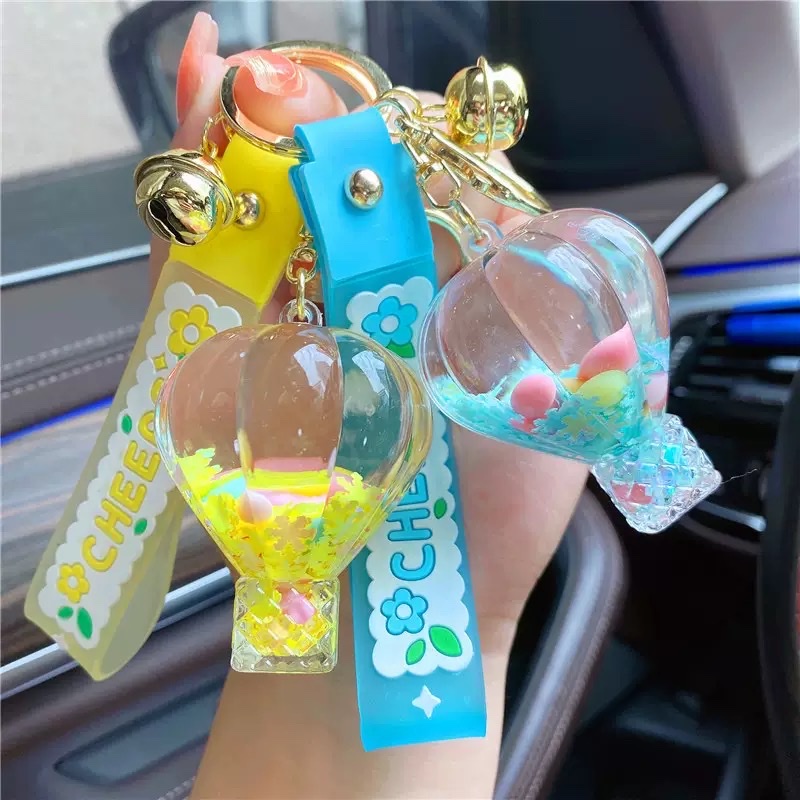 Creative oil, girlish heart, snowflake candy beans, flowing sand bottle, keychain, liquid drift, hot air balloon, key chain, small pendant, blind box Specification image