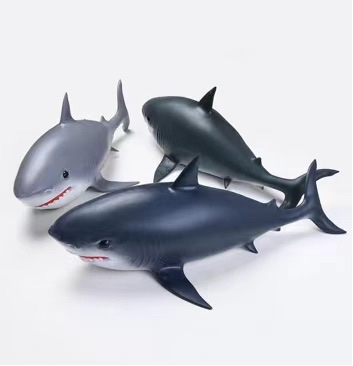 The big shark pinches the toy