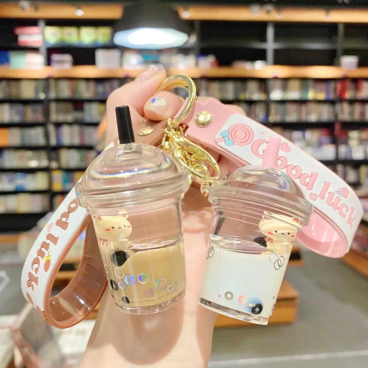 Internet-famous cartoon oil floating bubble milk tea bear keychain, cute and trendy car key chain, schoolbag pendant, blind box detail image 1