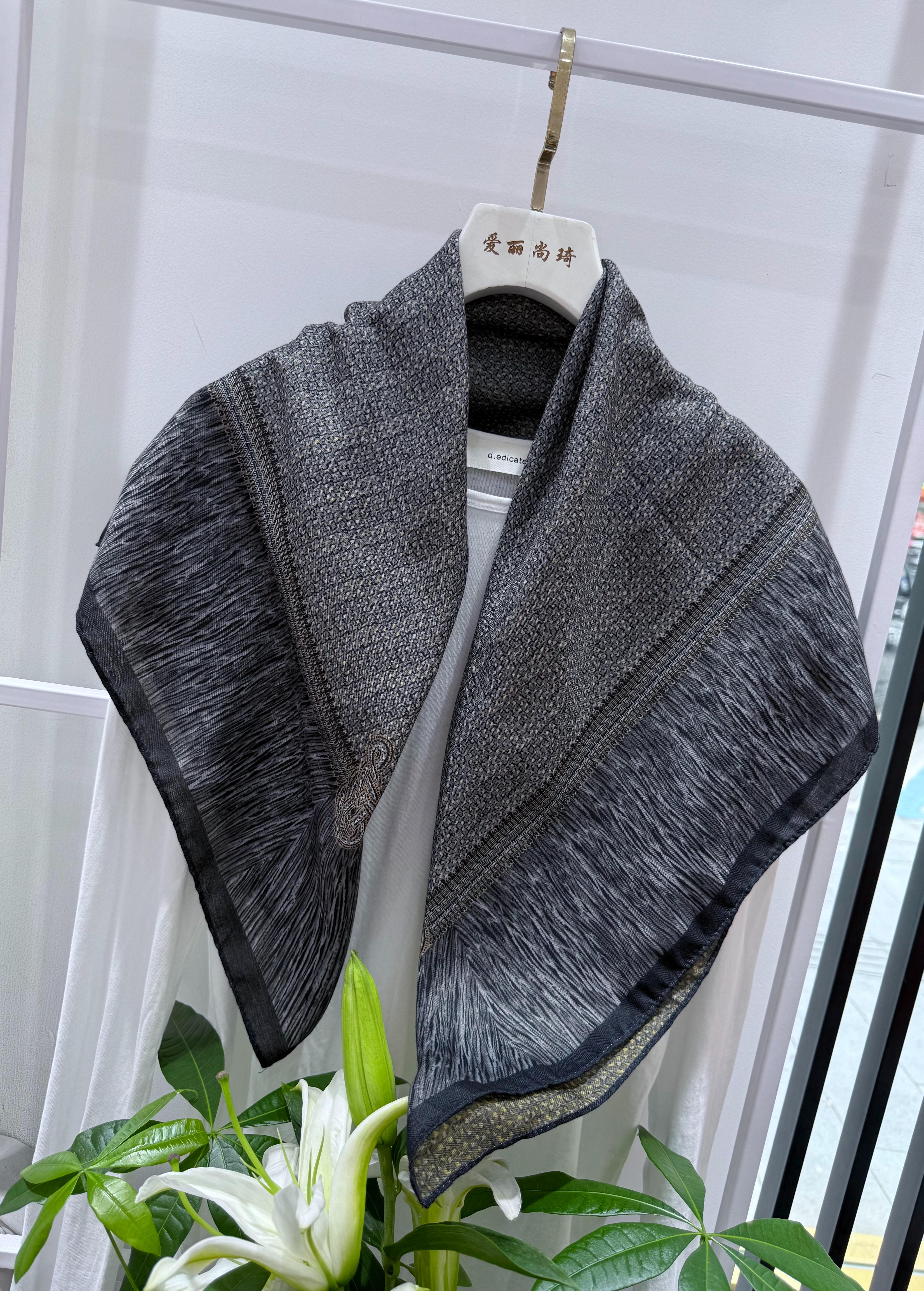 The new retro silk and wool square scarf is fashionable and simple. It is a soft and easy-to-match square scarf shawl