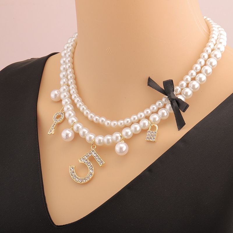 Elegant pearl imitation necklace with a collarbone fragrance style, light luxury high-end woven ins women's short Chanel style, multi-layered 5-shaped neck chain. Elegant pearl imitation necklace with a collarbone fragrance style, light luxury high-end woven ins women's short Chanel style, multi-layered Item Picture