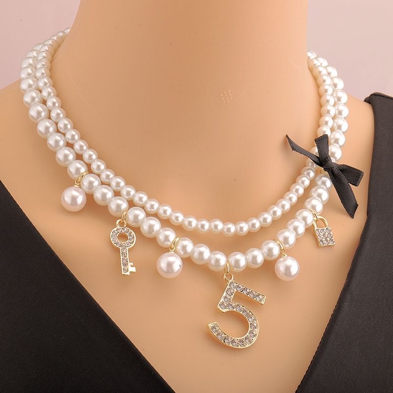 Elegant pearl imitation necklace with a collarbone fragrance style, light luxury high-end woven ins women's short Chanel style, multi-layered 5-shaped neck chain. Elegant pearl imitation necklace with a collarbone fragrance style, light luxury high-end woven ins women's short Chanel style, multi-layered Specification image