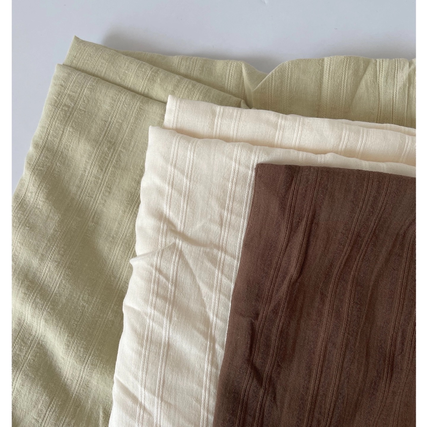 Apricot, fruit green, chestnut, solid color, striped, embroidered jacquard, exquisite semi-transparent pure cotton fabric for clothing