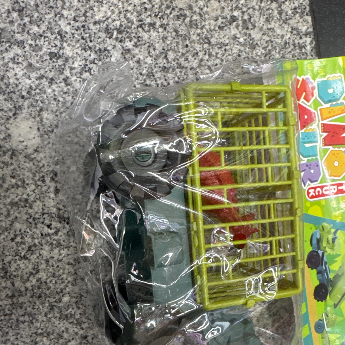 卡头袋的恐龙工程车，只有一个颜色的，绿色的4个轮子的滑行工程车。