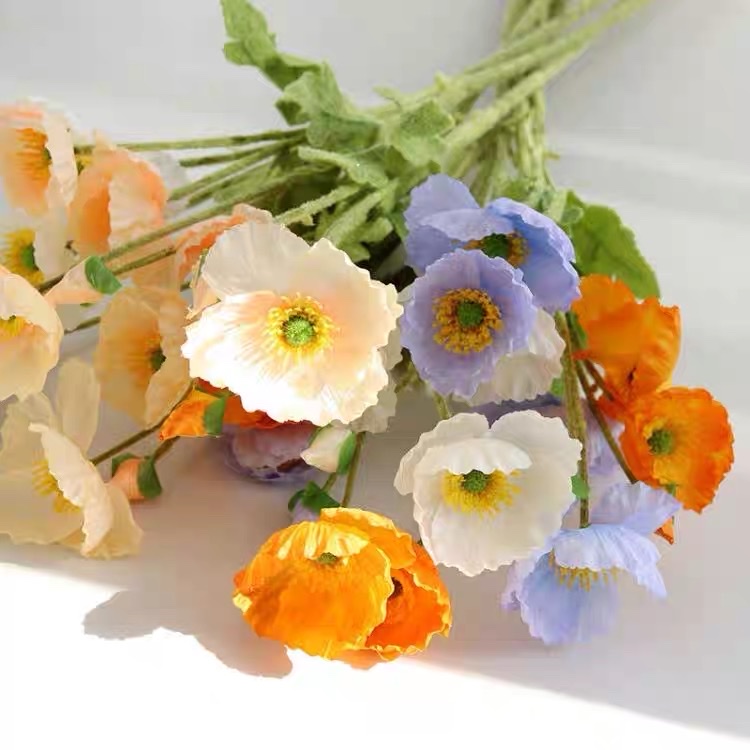 Four artificial flowers, a plush decorative flower by Yu Meiren, are placed on the living room table as wedding photography props details Picture