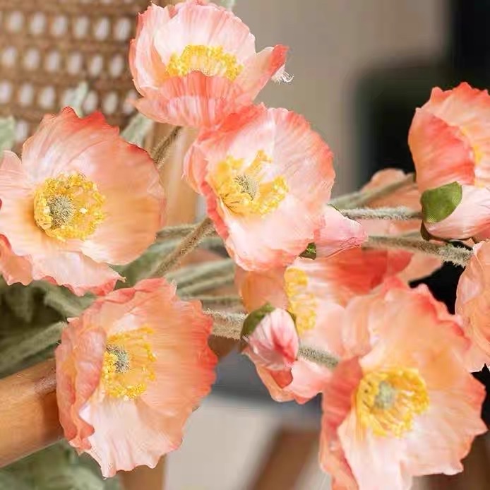 Four artificial flowers, a plush decorative flower by Yu Meiren, are placed on the living room table as wedding photography props Application Scenario