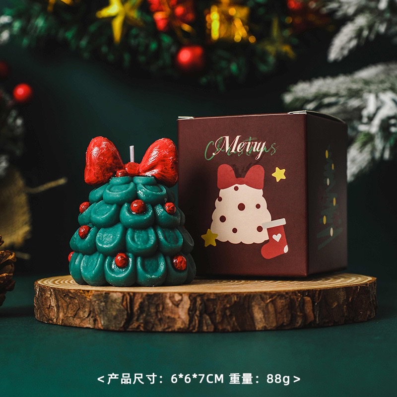 Bow Christmas tree scented candles create a festive atmosphere as a souvenir gift. Handcrafted scented Christmas tree shape wholesale candles scented wax for Christmas details Picture