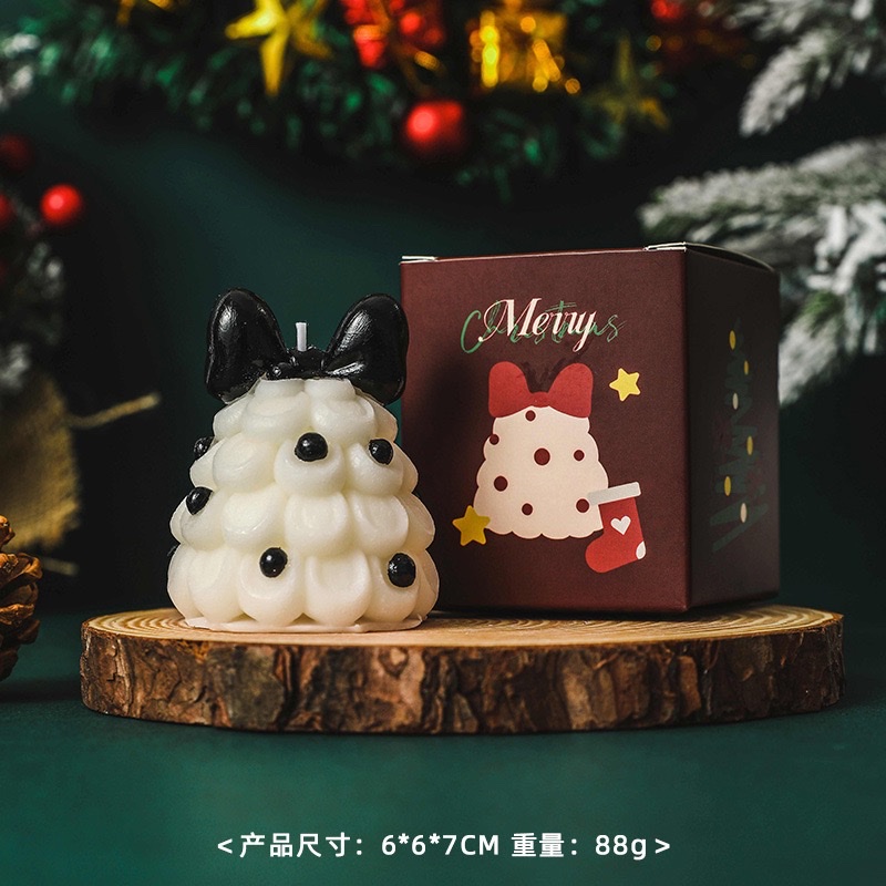 Bow Christmas tree scented candles create a festive atmosphere as a souvenir gift. Handcrafted scented Christmas tree shape wholesale candles scented wax for Christmas Specification image