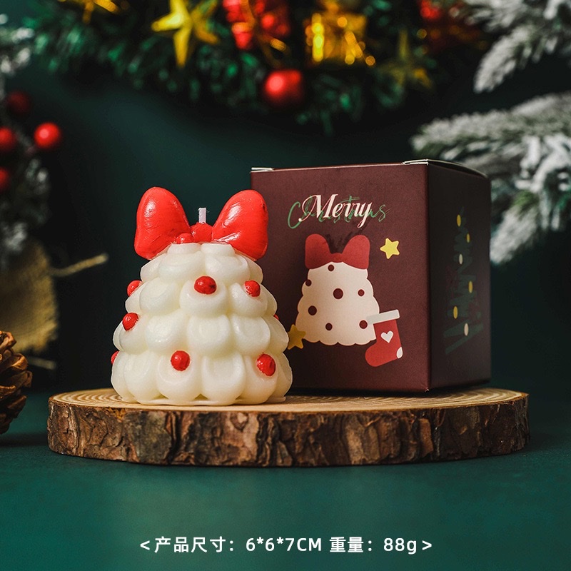 Bow Christmas tree scented candles create a festive atmosphere as a souvenir gift. Handcrafted scented Christmas tree shape wholesale candles scented wax for Christmas Item Picture