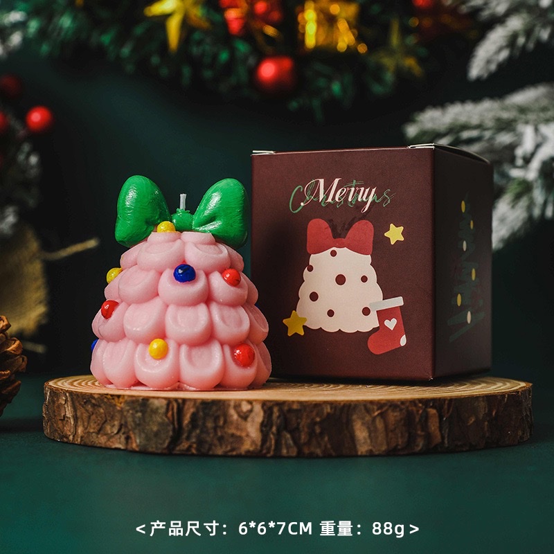 Bow Christmas tree scented candles create a festive atmosphere as a souvenir gift. Handcrafted scented Christmas tree shape wholesale candles scented wax for Christmas Application Scenario