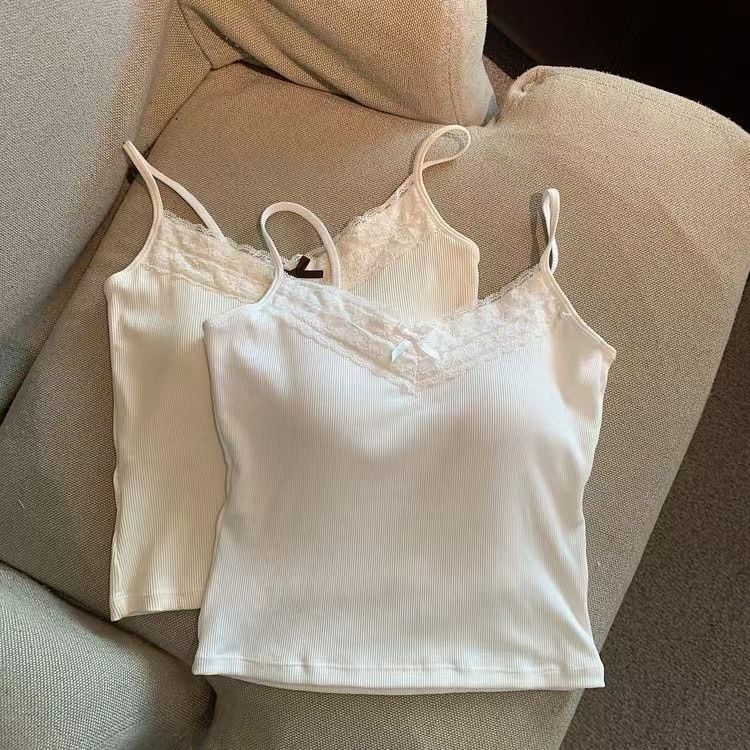 The pure and elegant lace halter vest for women, with a bra pad and a bow, is sexy, versatile, and form-fitting. It can be worn as an outer layer or as an inner layer with a base top undefined