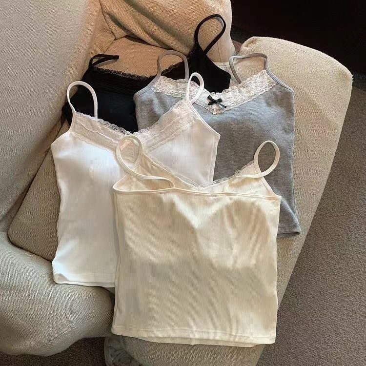 The pure and elegant lace halter vest for women, with a bra pad and a bow, is sexy, versatile, and form-fitting. It can be worn as an outer layer or as an inner layer with a base top undefined