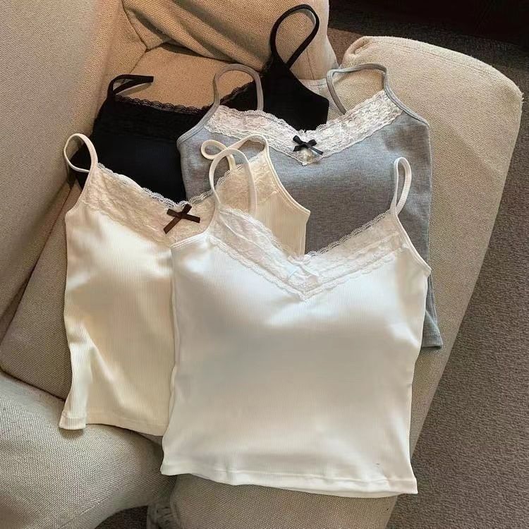 The pure and elegant lace halter vest for women, with a bra pad and a bow, is sexy, versatile, and form-fitting. It can be worn as an outer layer or as an inner layer with a base top undefined