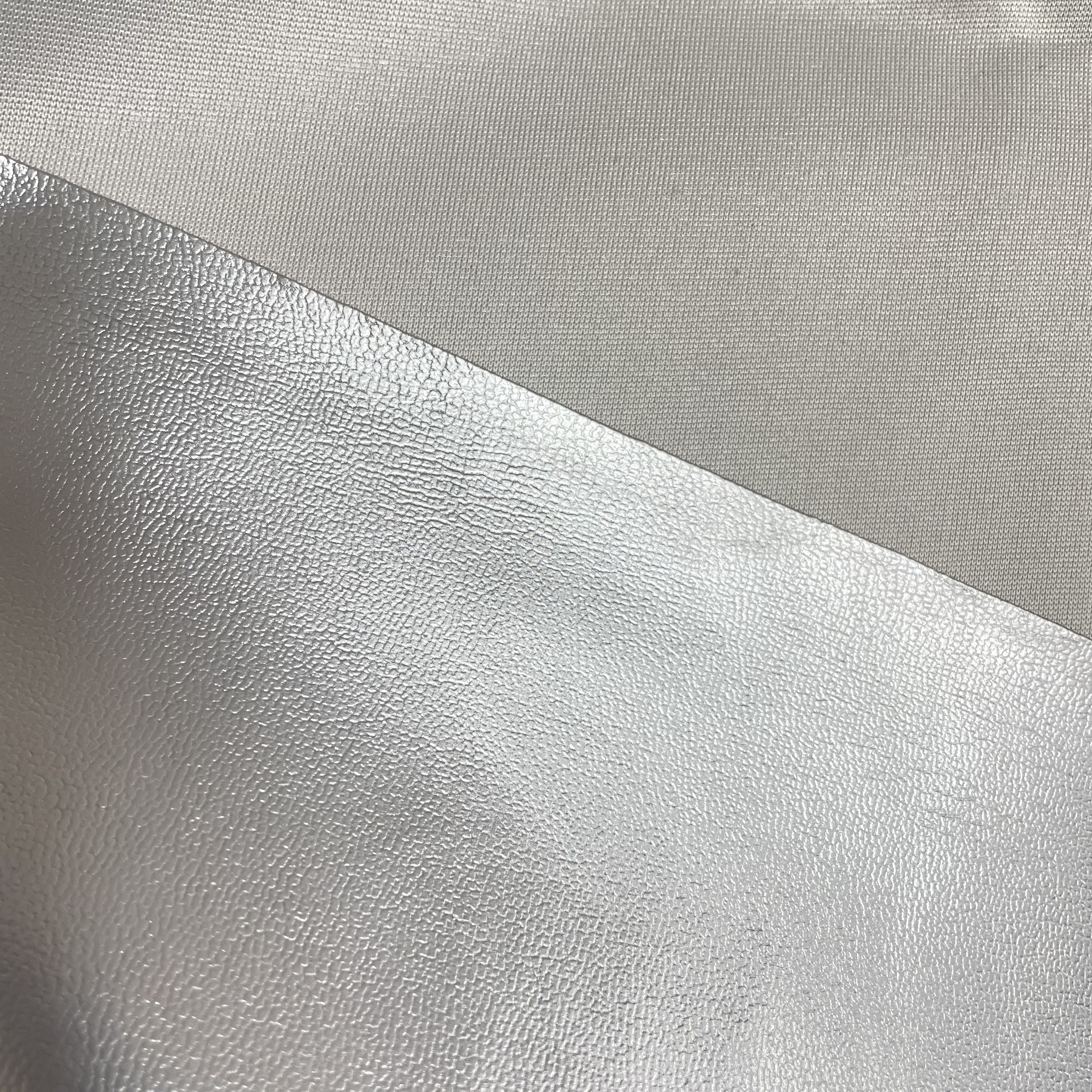 We are in stock of 0.6mm thick, 1.5-meter door width, and double-sided elastic semi-PU silver motorcycle and electric bike seat cover materials Specification image