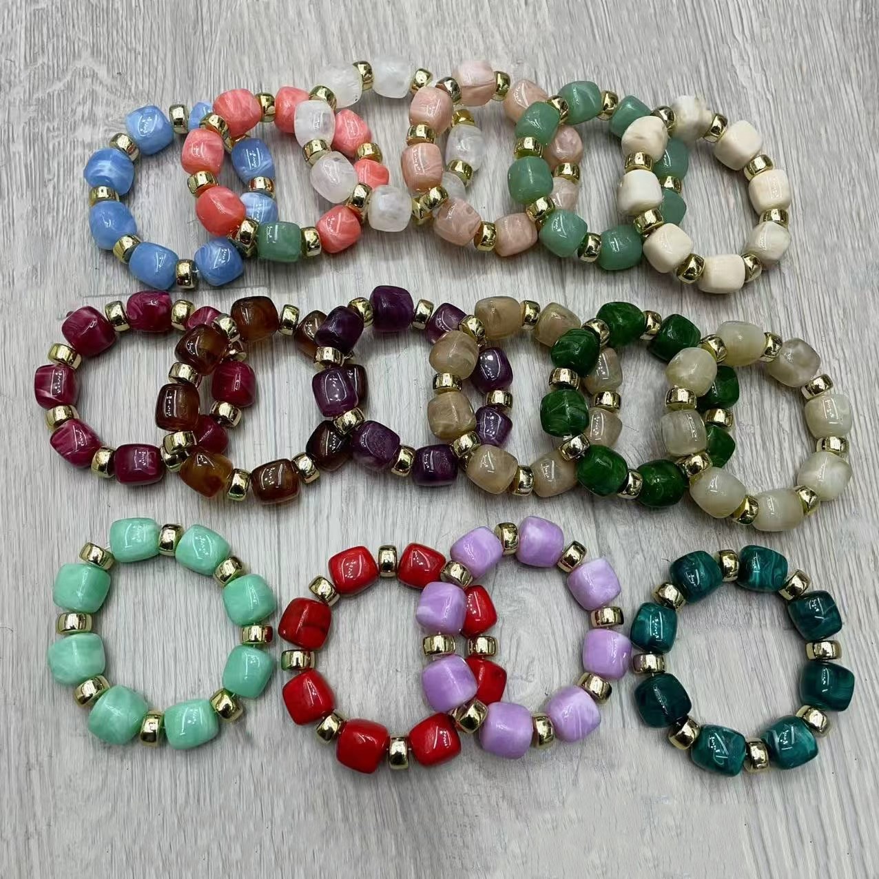 The new product is a color-coated acrylic bracelet with a beaded design, featuring a simple and versatile design