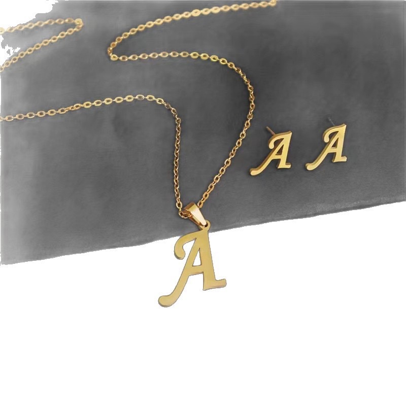 European and American cross-border fashion personality 26-letter stainless steel color-preserving pendant necklace earring set http://detail.m... com/page/index.htm? offerId=970919460526 Item Picture