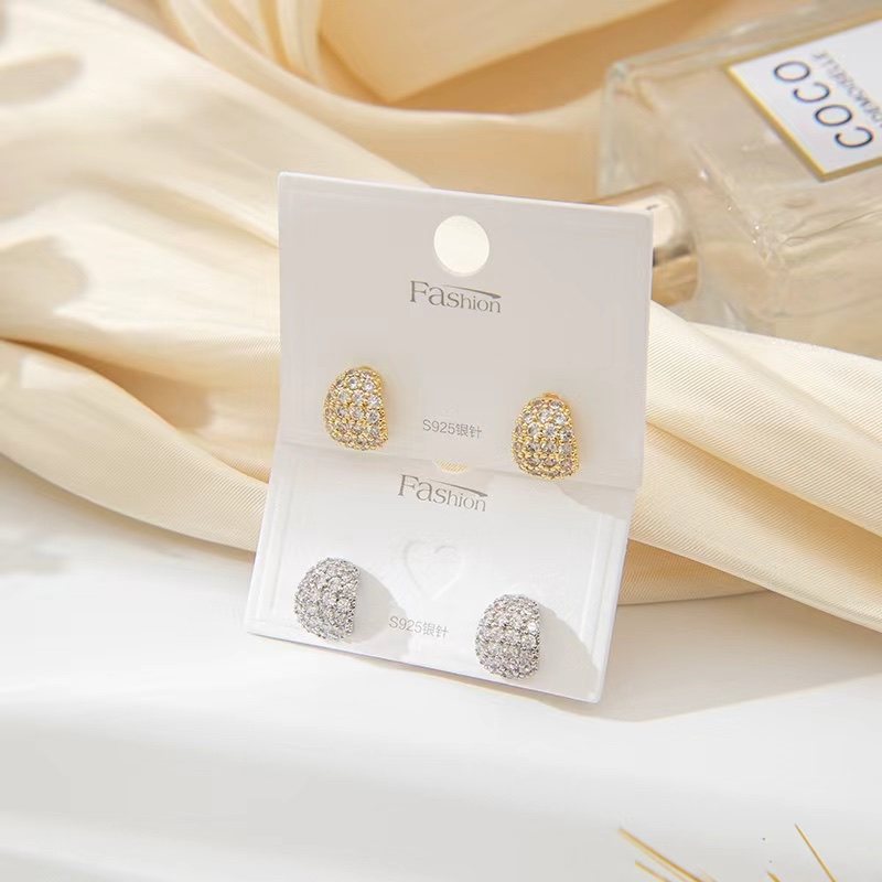 The stud earrings are popping details Picture