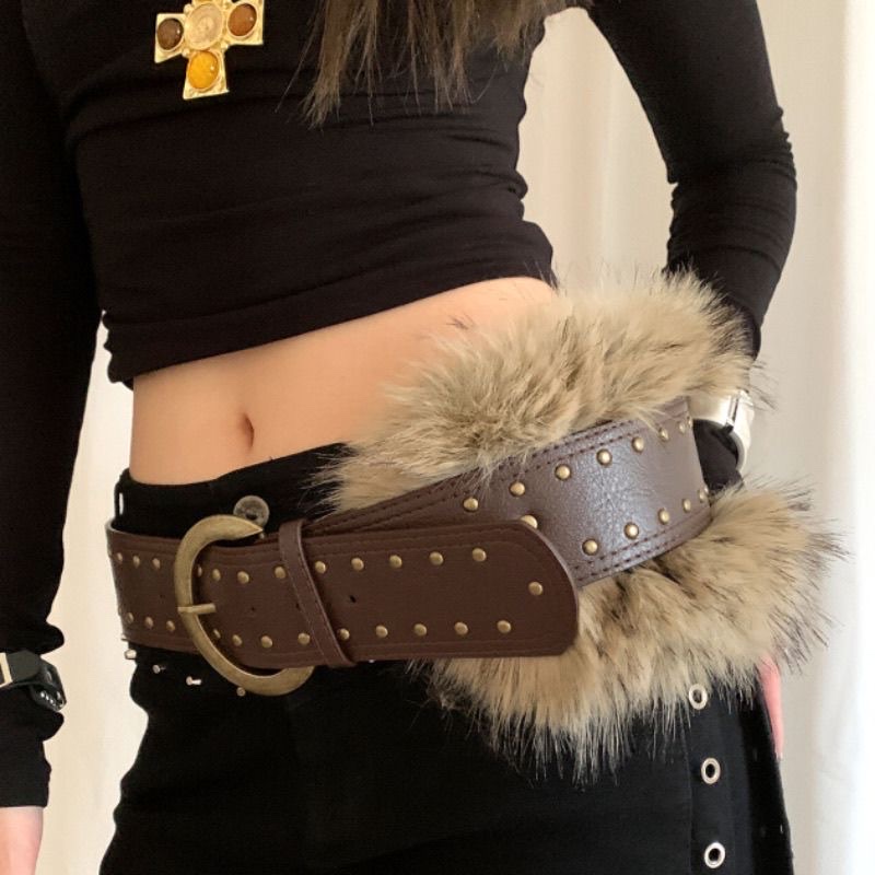 A retro punk-style rivet wide belt for women paired with a skirt, denim pants at the waist, and a trendy brown belt accessory details Picture