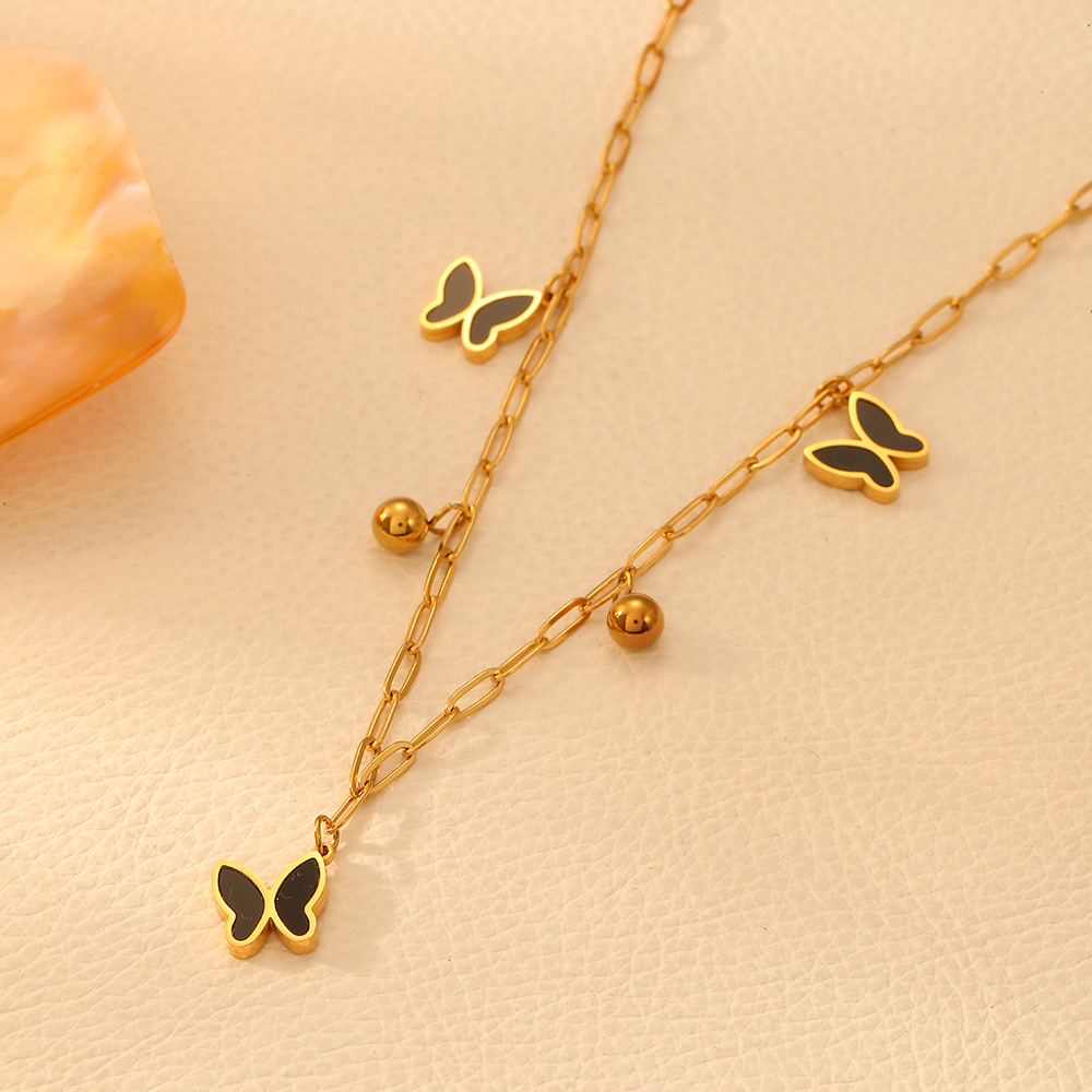 Cross-border stainless steel five-leaf flower heart-shaped butterfly necklace, European and American color preservation butterfly shell steel ball light luxury necklace for women detail image 3
