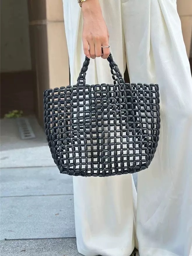 This fairy-like wooden beaded hand-woven bag is exquisitely handcrafted. It is a Japanese-style bag