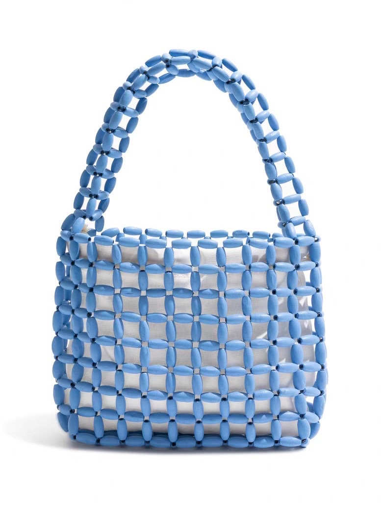 A new Instagram-style women's hand-held handbag with wooden beads and a hollowed-out design. It features a pure handcrafted beaded design in macaron color detail image 3