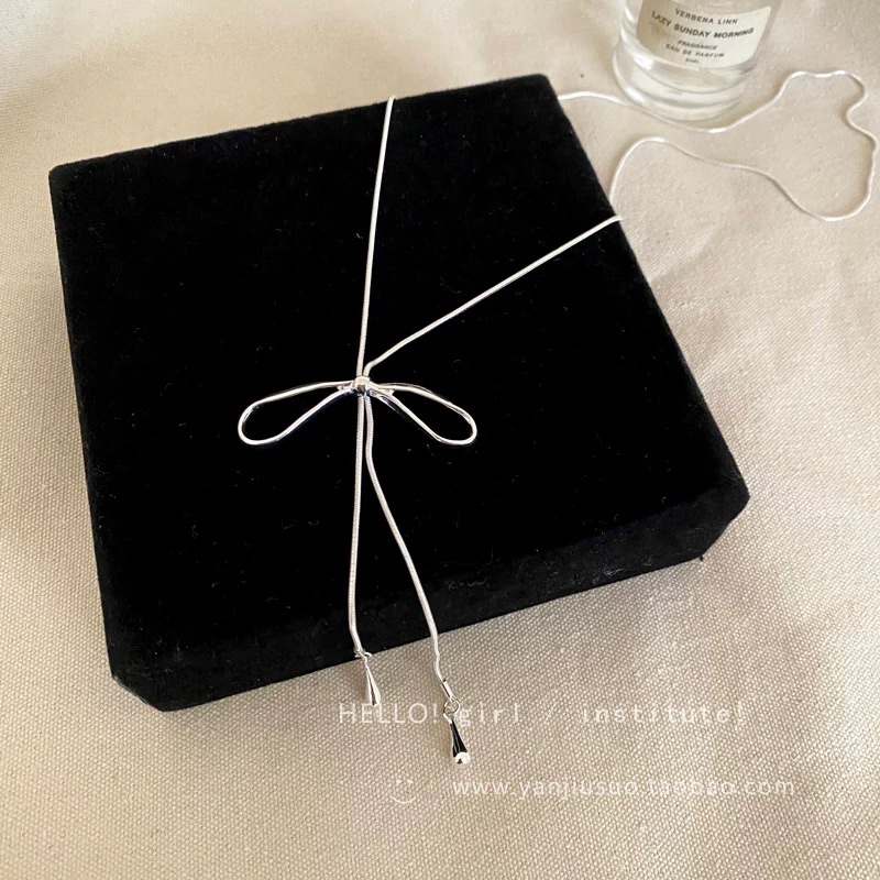 Silver bow tassel necklace for women's autumn and winter long pull-up sweater chain, light luxury and high-end, simple and versatile accessory Item Picture