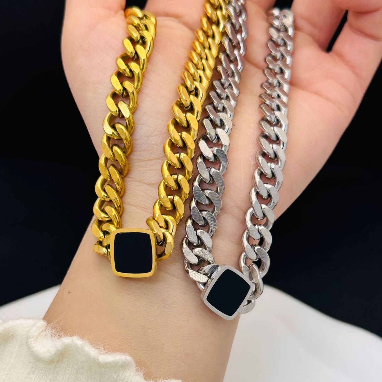 A stylish black square titanium steel thick chain necklace with a unique and versatile European and American style. The black square collarbone chain does not fade for women