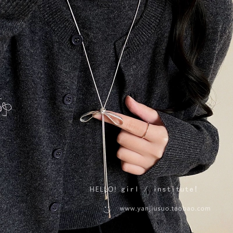 Silver bow tassel necklace for women's autumn and winter long pull-up sweater chain, light luxury and high-end, simple and versatile accessory Application Scenario