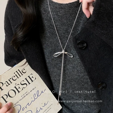 Silver bow tassel necklace for women's autumn and winter long pull-up sweater chain, light luxury and high-end, simple and versatile accessory Silver bow tassel necklace for women's autumn and winter long pull-up sweater chain, light luxury and high-end, simple and versatile accessory