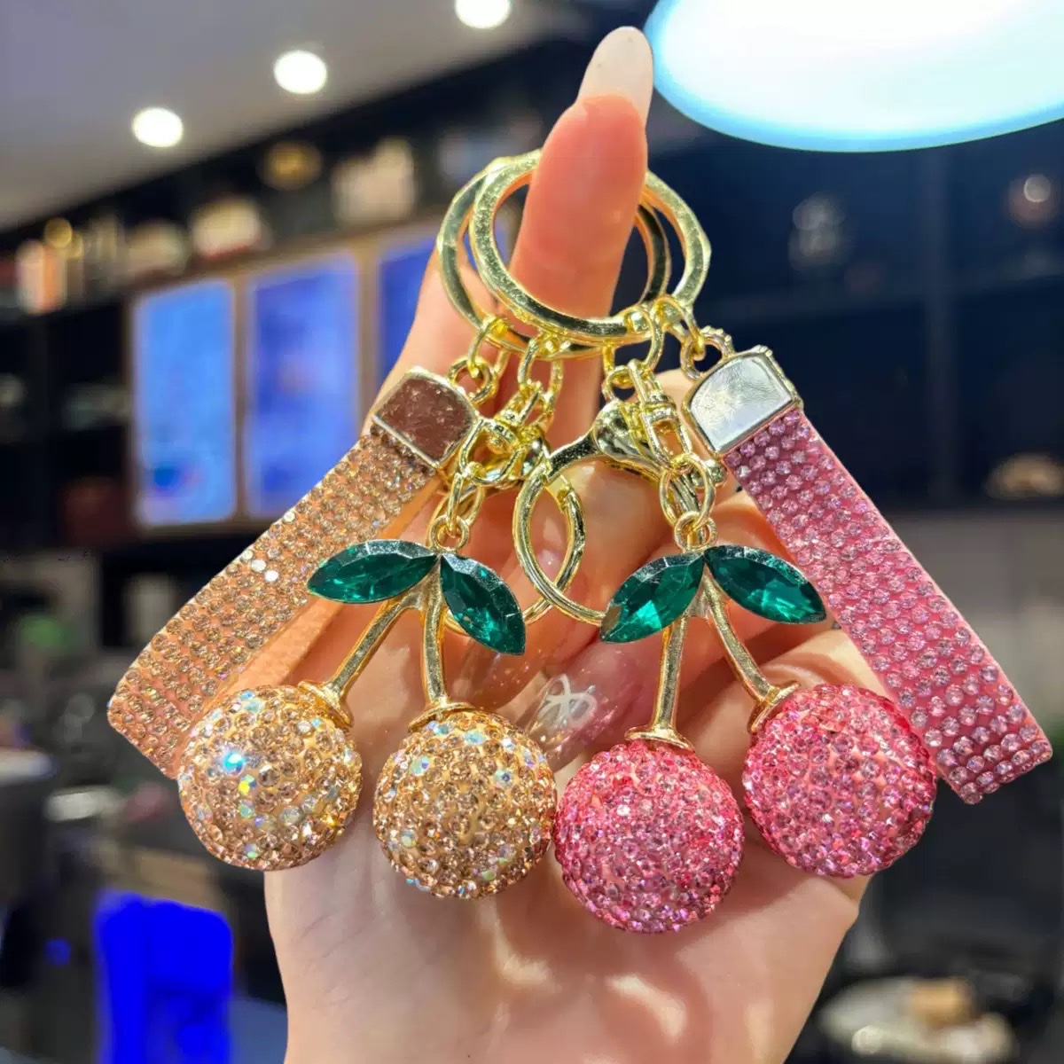 Amazon's best-selling cute and realistic water diamond cherry keychain, a baby car bag pendant with a full diamond of clay and cherries details Picture
