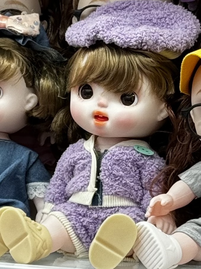 A mixed-style cute doll dressed up in a cute and funny expression, playing house with a girl with bangs as a birthday gift