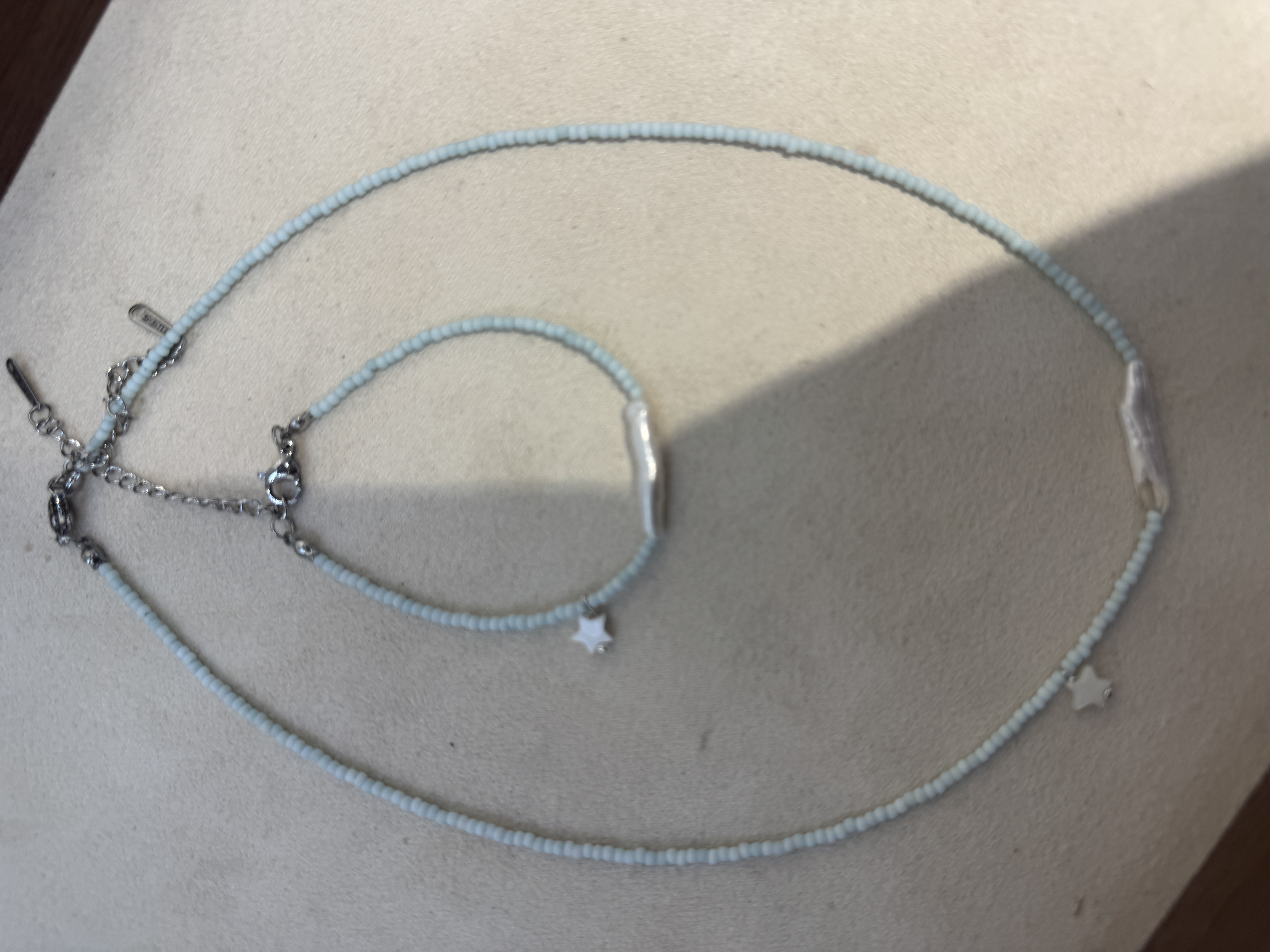 银饰珍珠项链女款拼接气质珍珠链条进口捷克珠，尾链钛钢不掉色，原创设计细节图