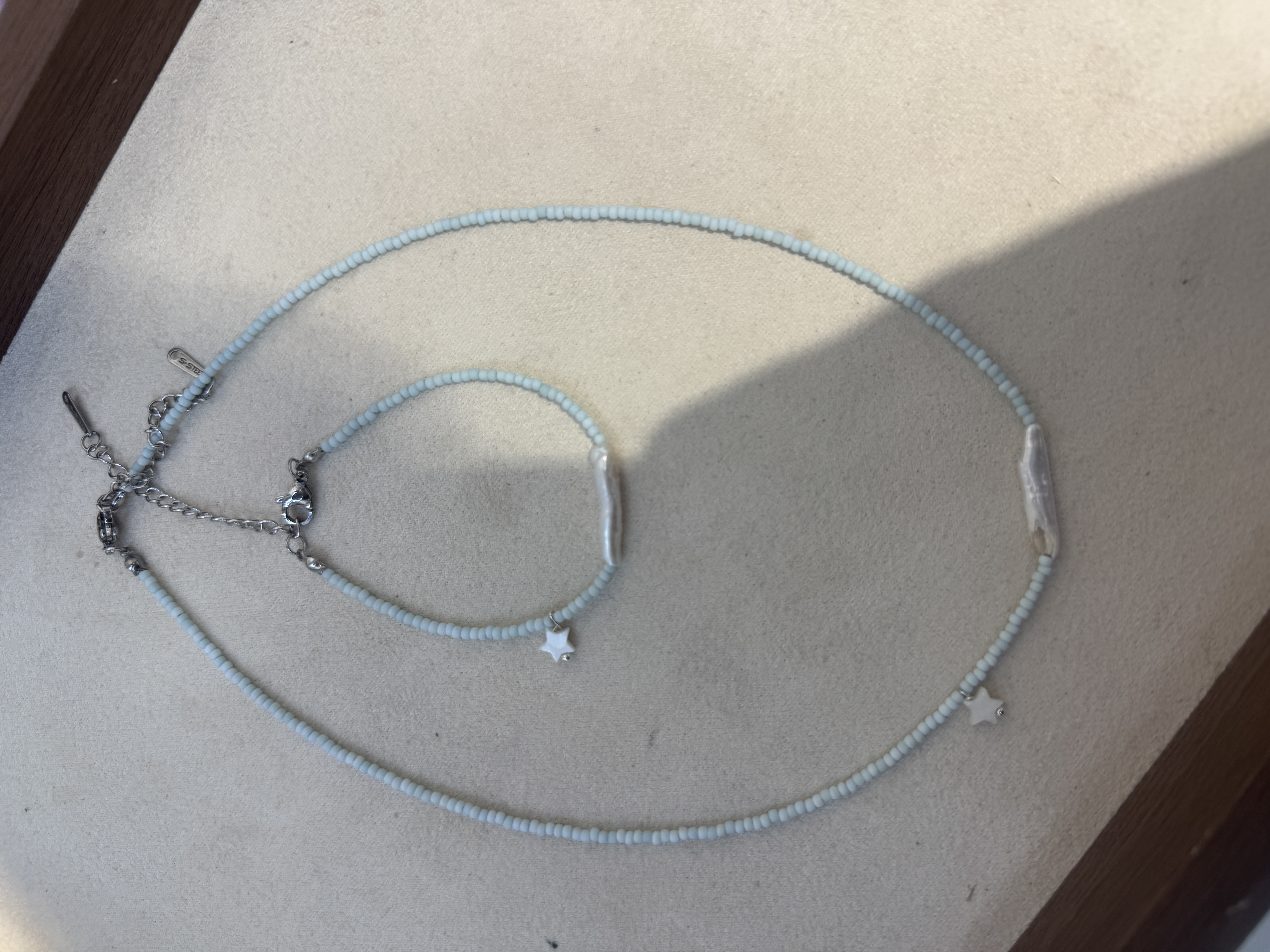 银饰珍珠项链女款拼接气质珍珠链条进口捷克珠，尾链钛钢不掉色，原创设计产品图