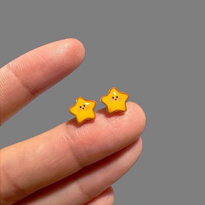 Cute and unique yellow star-shaped ear studs with a distinctive design, sweet and versatile dopamine earrings for summer