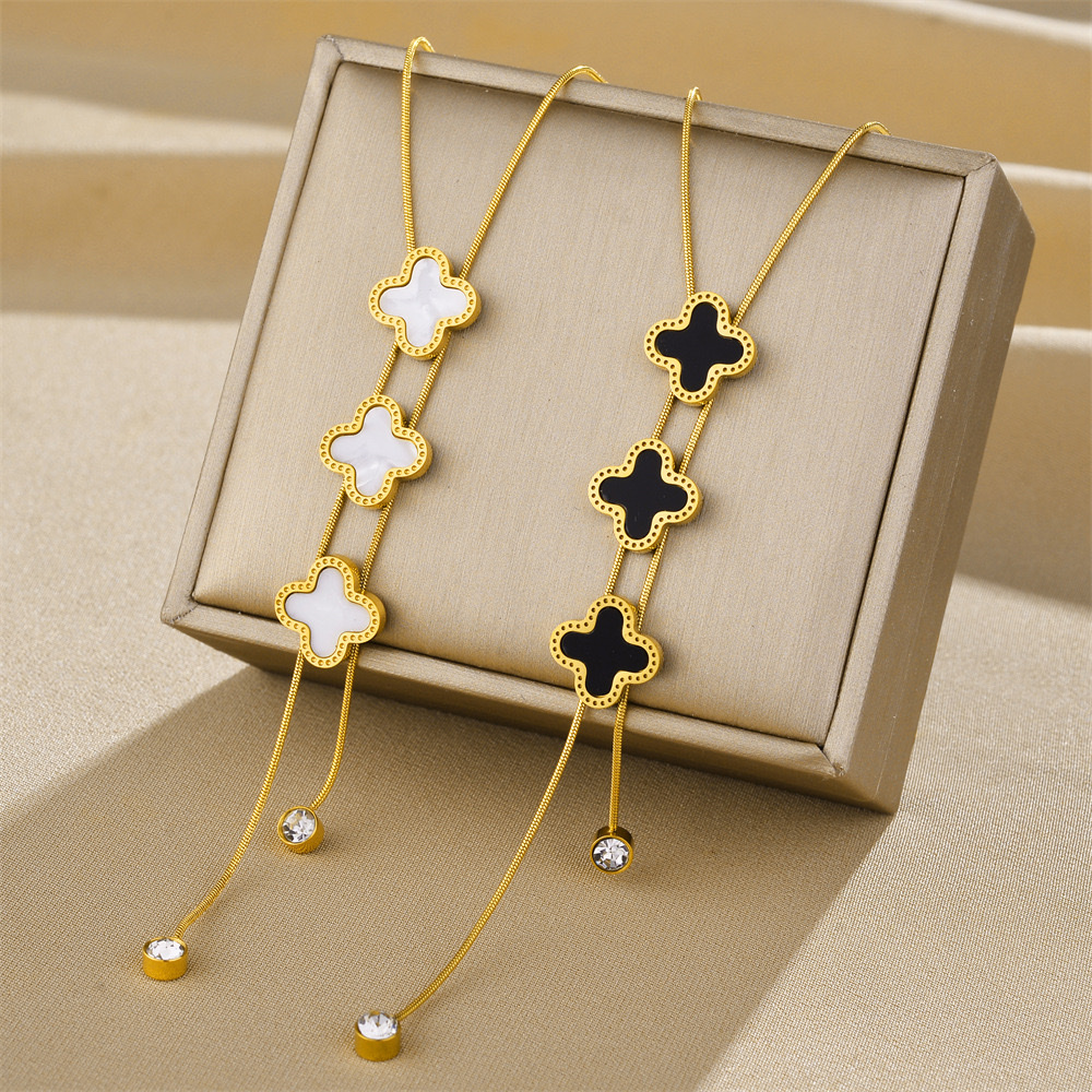 The new Xinyun four-leaf clover tassel diamond pendant accessory, titanium steel necklace, women's light luxury and high-end collarbone chain